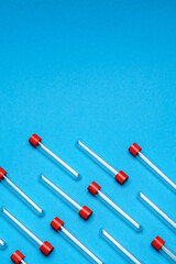 top view of medicine test tubes for blood samples over blue background