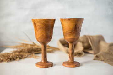 Glass made of wood. Craft wooden glass. Handmade wooden tableware.
