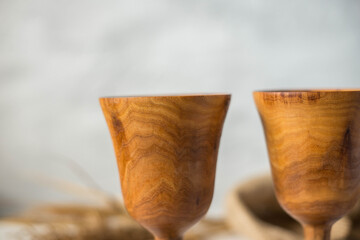 Glass made of wood. Craft wooden glass. Handmade wooden tableware.