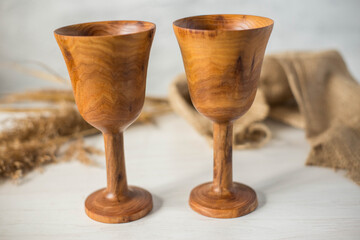 Glass made of wood. Craft wooden glass. Handmade wooden tableware.