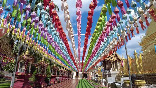 Beautiful and colorful traditional northern Thai style paper lanterns decorating at the temple during the end of the rainy season.