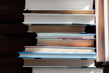 Many colorful books on the shelf.