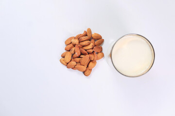  almond nut and milk on table top down
