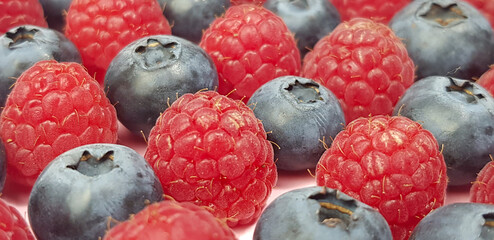 background is   made of raspberry and biueberry