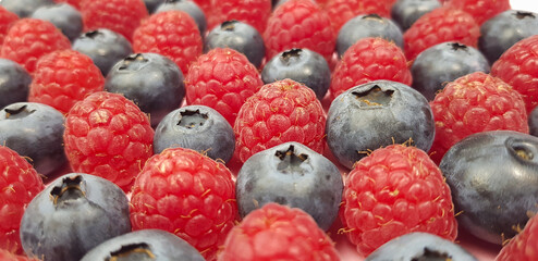background is   made of raspberry and biueberry
