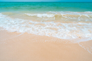 Beautiful quiet white sand beach and sea wave in Tropical ocean summer time.