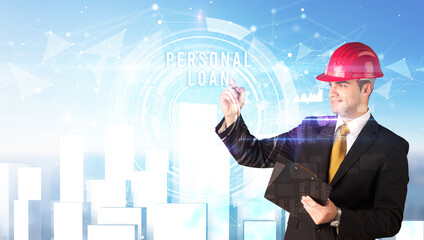Handsome businessman with helmet drawing PERSONAL LOAN inscription, contruction business concept
