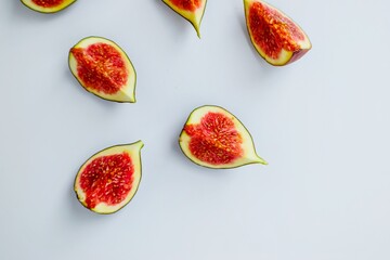 Bright juicy ripe figs on a white background cut into pieces. The concept of healthy food.