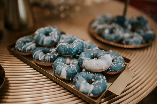 blue donuts on baby shower gender reveal party