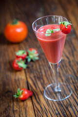 gazpacho with strawberry and tomato presented in a cocktail glass