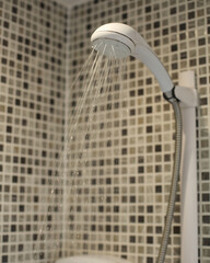 shower head in the bathroom with water