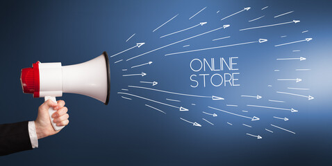 Young girl screaming to megaphone with ONLINE STORE inscription, shopping concept