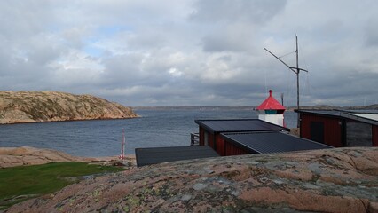 Fototapeta na wymiar A lighthouse on the ocean coast in southwestern Sweden