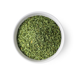 Dried parsley in a white bowl on a white background