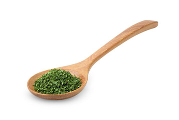 Dried parsley in wood spoon on a white background