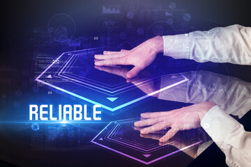 Hand touching digital table with RELIABLE inscription, new age security concept