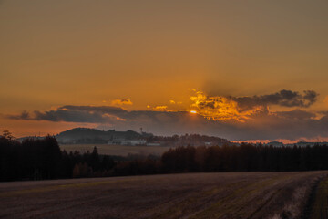 Big color meadows and forest with sunset sky near Utery town