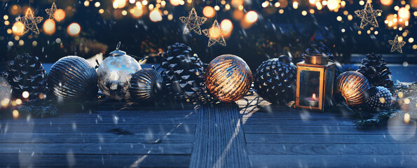 Christmas decoration in darkness
Christmas decoration on a wooden table in darkness with golden...