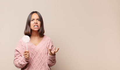 young woman looking angry, annoyed and frustrated screaming wtf or what’s wrong with you