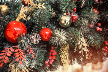 Christmas background-colored toys hang on the Christmas tree
