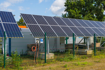 solar charging station in Berlin. solar panels generate renewable energy to recharge electric cars.