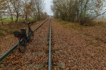Old railway siding near Ceske Budejovice city to airport with electric bicycle