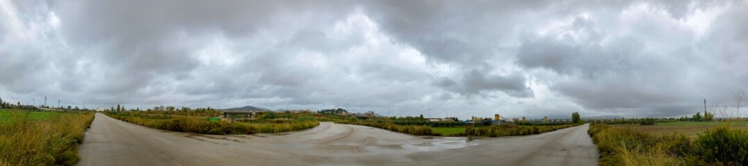 Panoramic agricultural landscape of a Town in a rainy day