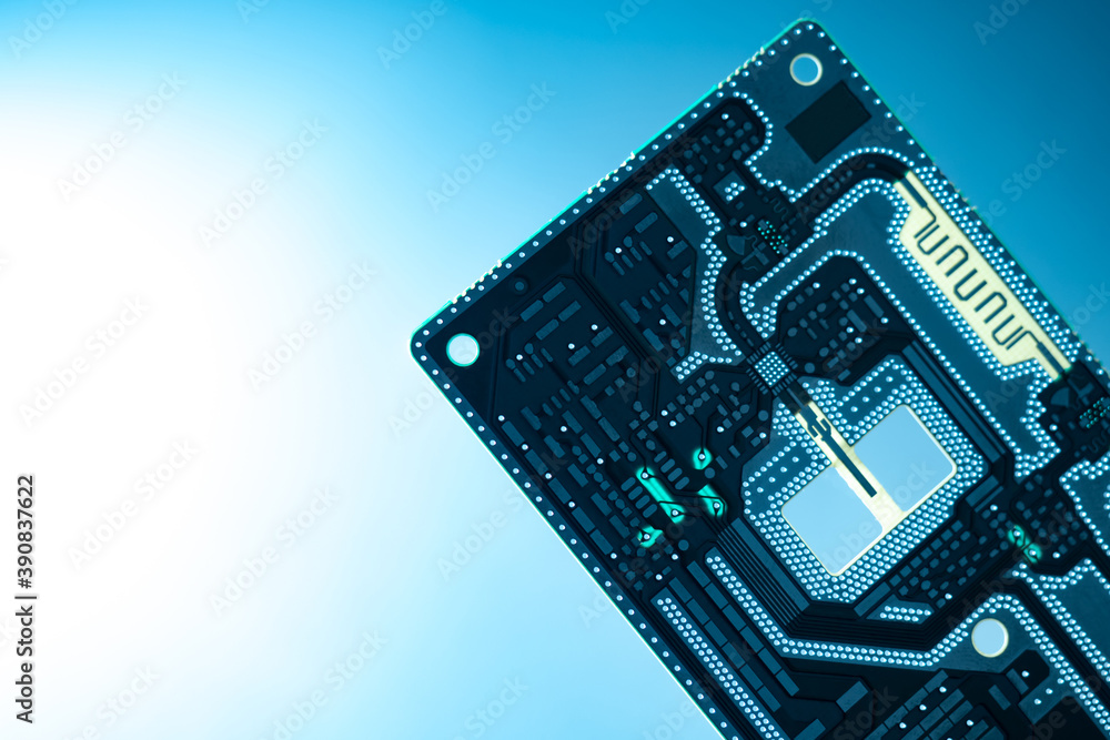 Poster fragment of a printed circuit board close-up. white-blue gradient in background. concept - productio