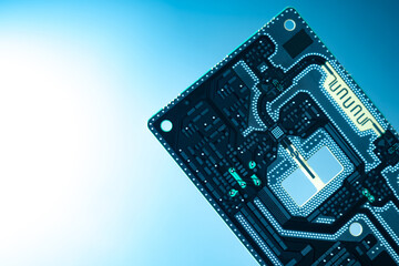 Fragment of a printed circuit board close-up. White-blue gradient in background. Concept -...