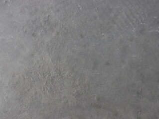 Obraz premium The texture of the gray decorative plaster background for design.