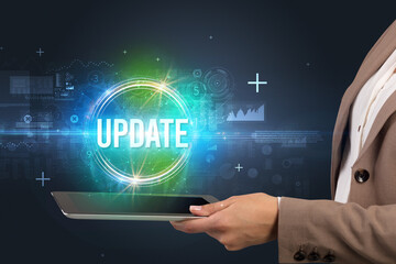 Close-up of a touchscreen with UPDATE inscription, new technology concept