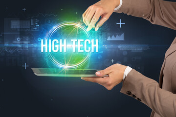 Close-up of a touchscreen with HIGH-TECH inscription, new technology concept