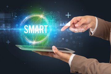 Close-up of a touchscreen with SMART inscription, new technology concept