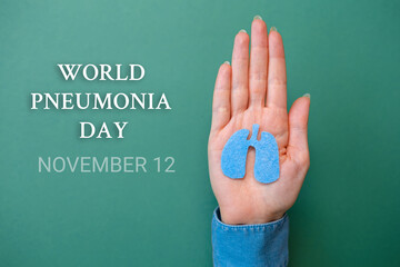 World pneumonia day, 12th november. Woman's hands hold the cut-out silhouette of the lungs. Flat...