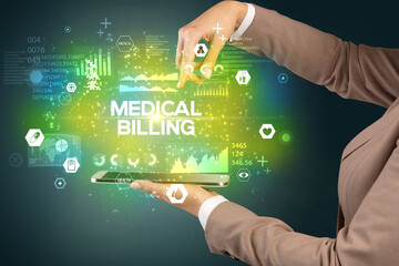 Close-up of a touchscreen with MEDICAL BILLING inscription, medical concept