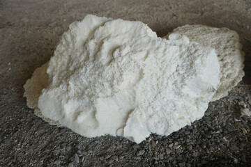 Fototapeta na wymiar Scraps of pieces of Polyurethane foam (PU foam) on the floor, Polyurethane foam 