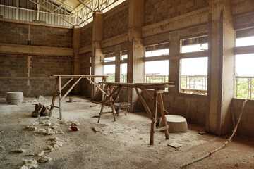 Hall in the unfinished building. A room in an unfinished house. construction site.