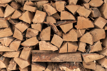 The woodpile, firewood as a background, chopped wood masonry