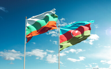 Beautiful national state flags of Azerbaijan and Bulgaria together at the sky background. 3D artwork concept.