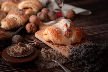 A croissant surrounded by other sugar-coated croissants