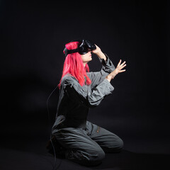 Fototapeta na wymiar Virtual reality and futurism. Cyber punk concept, a gamer with pink hair.