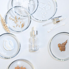 Serum for skin care, eco-friendly cosmetics. Bottles and ingredients