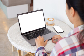 computer,cell phone mockup.hand woman work using laptop texting mobile.blank screen with white background for advertising,contact business search information on desk in cafe.marketing,design