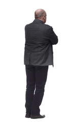 rear view . confident business man looking at the white wall