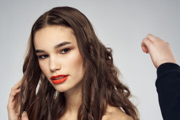 Fototapeta premium Beautiful woman fashionable hairstyle grooming naked shoulders bright makeup