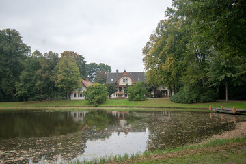 Beautiful view of a lake surrounded by greenery in a park in Bremen, Germany