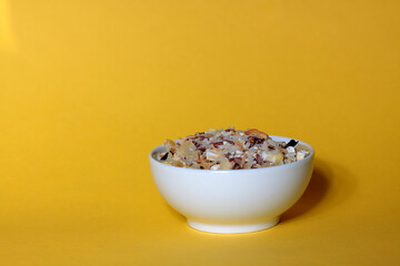 white bowl of soup blend isolated against yellow background