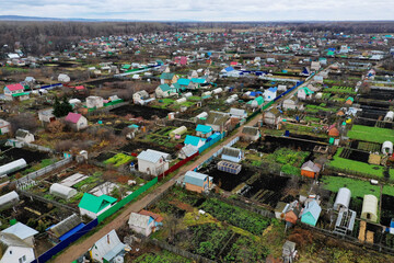 Dachas and summer cottages in the suburbs. Aerial view.