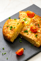 Spanish tortilla with tomatoes and chive