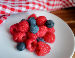 raspberries and Blueberries on a plate